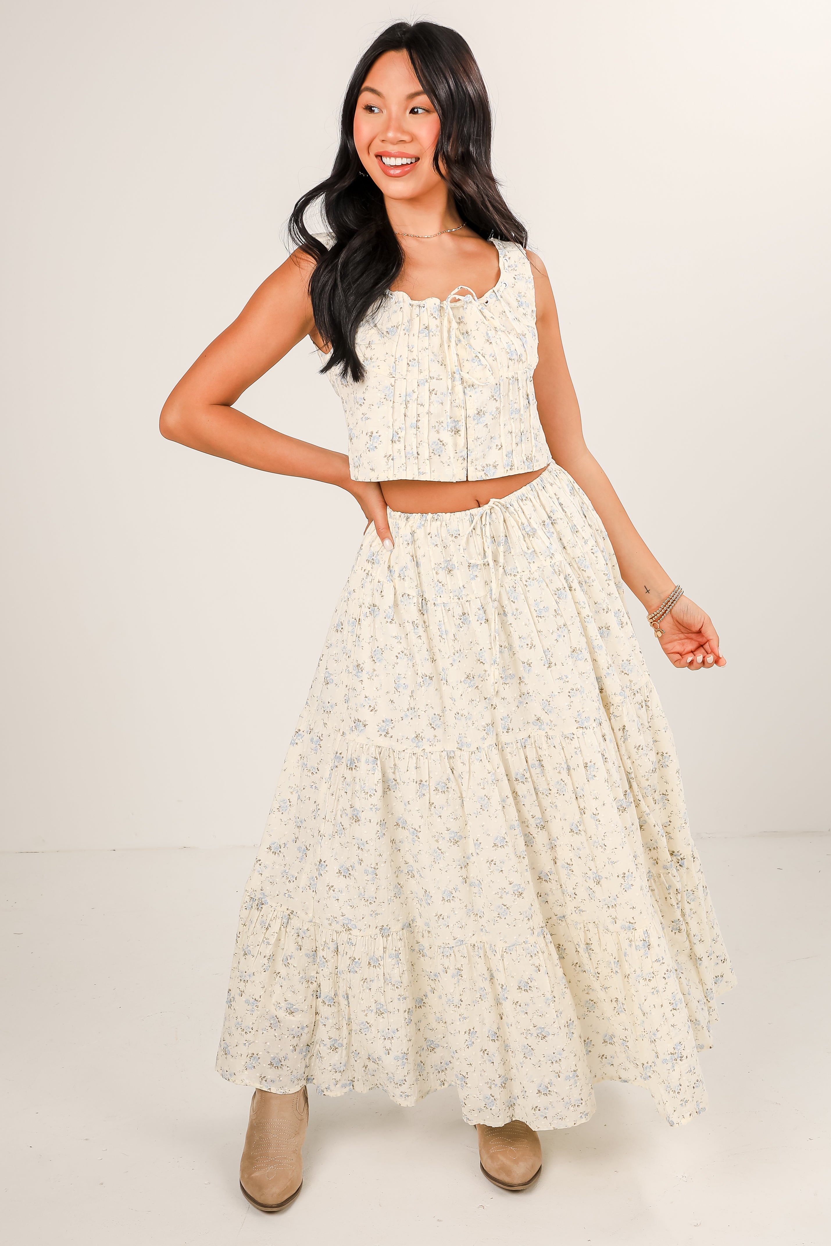 Woman wearing a floral dress with a white background