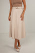 Person wearing a beige skirt with a belt on a plain background