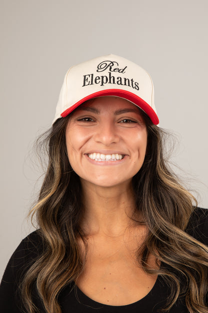 Woman wearing a cap with &