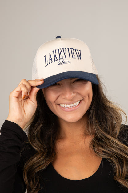 Woman wearing a white cap with &