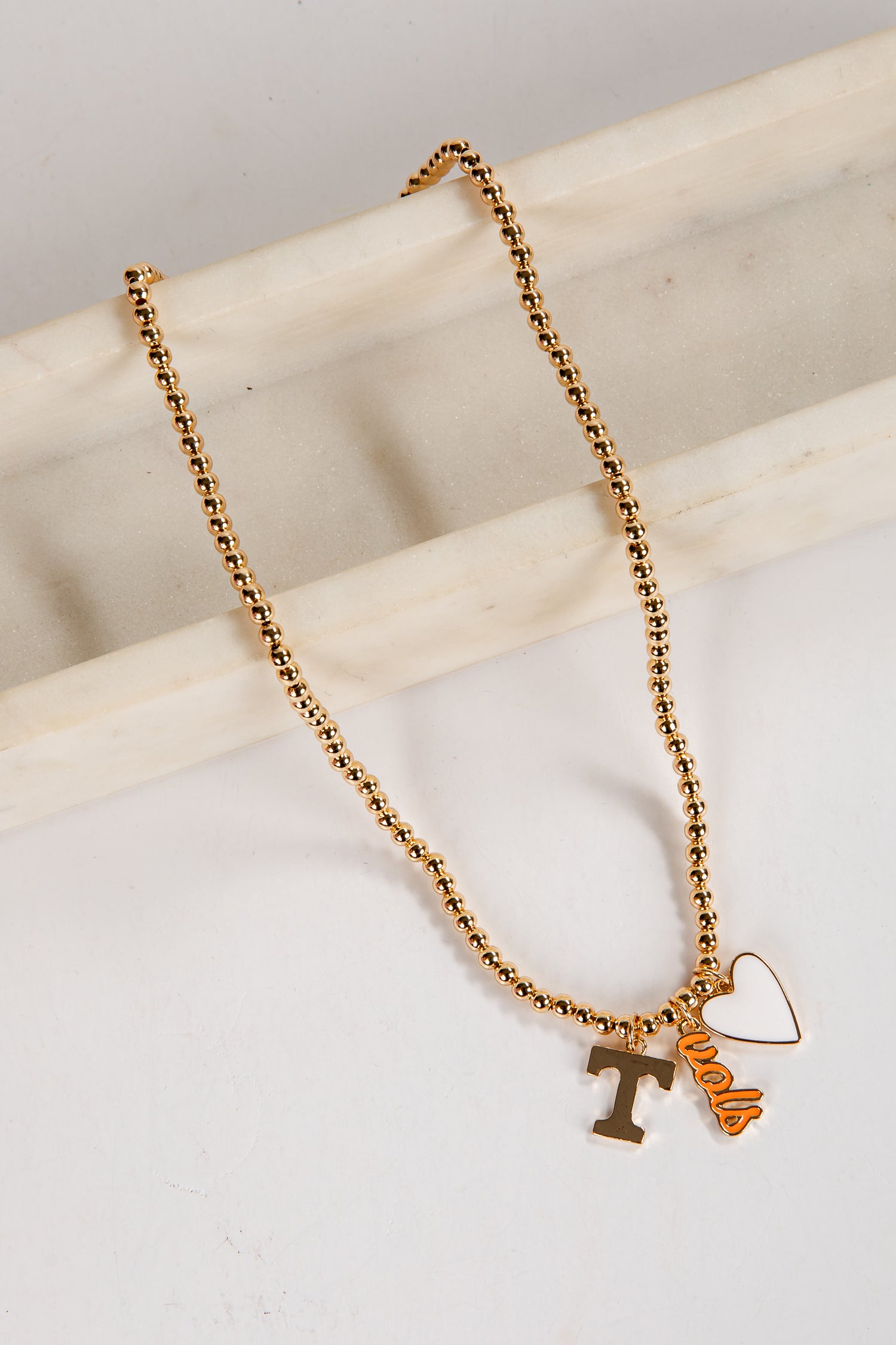 Gold necklace with a &