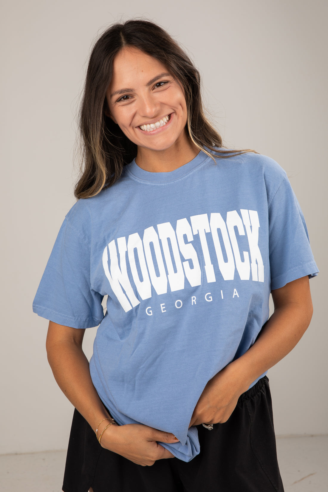 Woman wearing a blue t-shirt with &