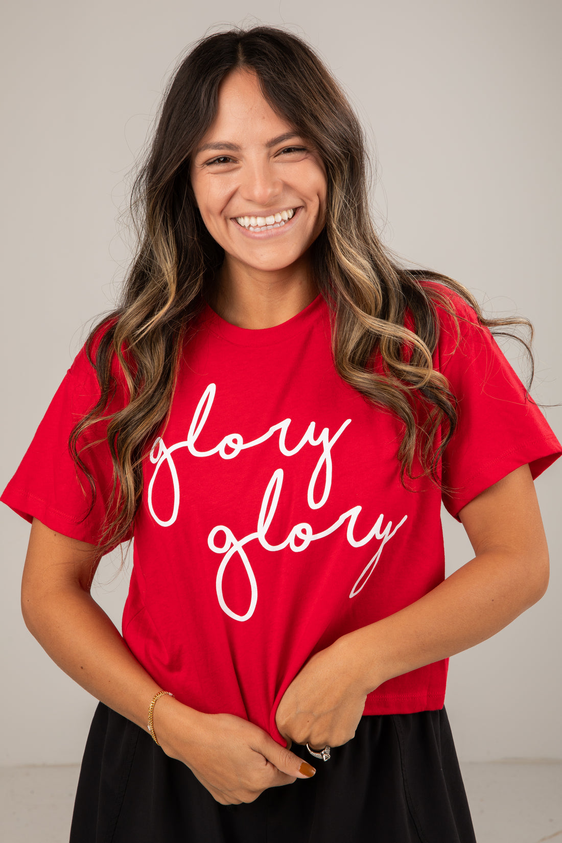 Woman wearing a red t-shirt with &