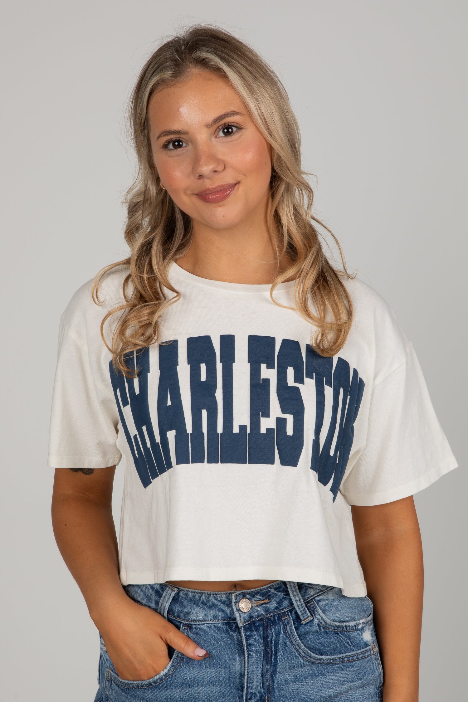 Woman wearing a white t-shirt with &