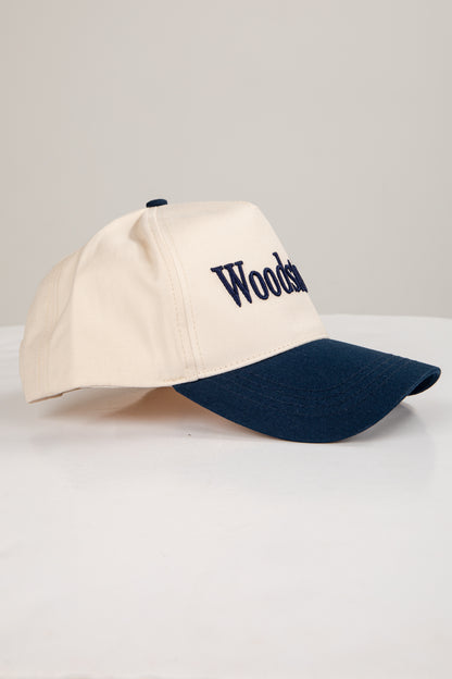 Beige and navy cap with &