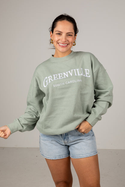 Woman wearing a green &