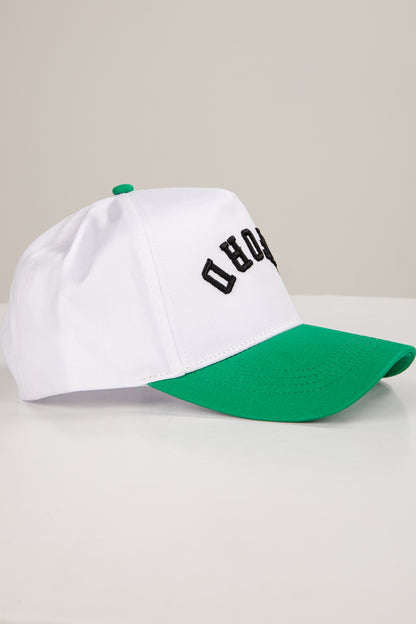 White and green cap with black text on a light gray background