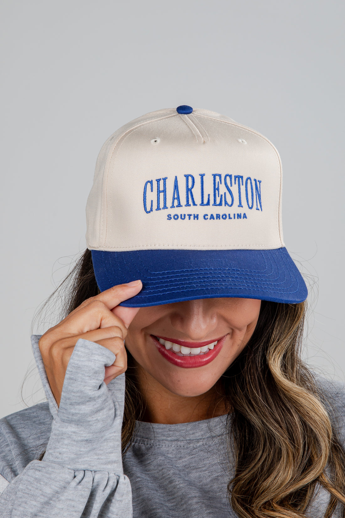 Person wearing a cap with &