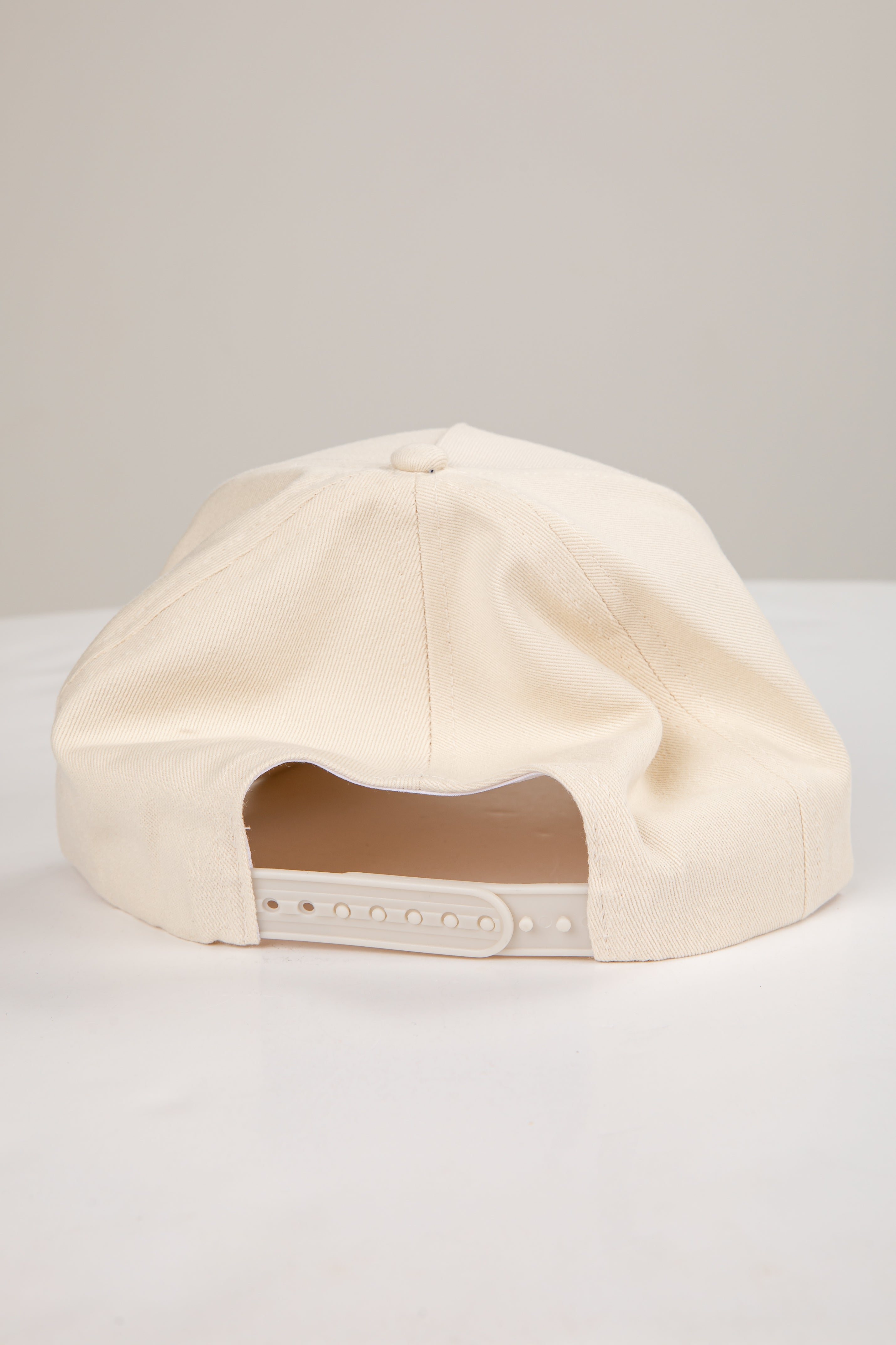 Beige cap on a light gray background