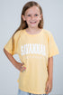Young girl wearing a yellow t-shirt with &