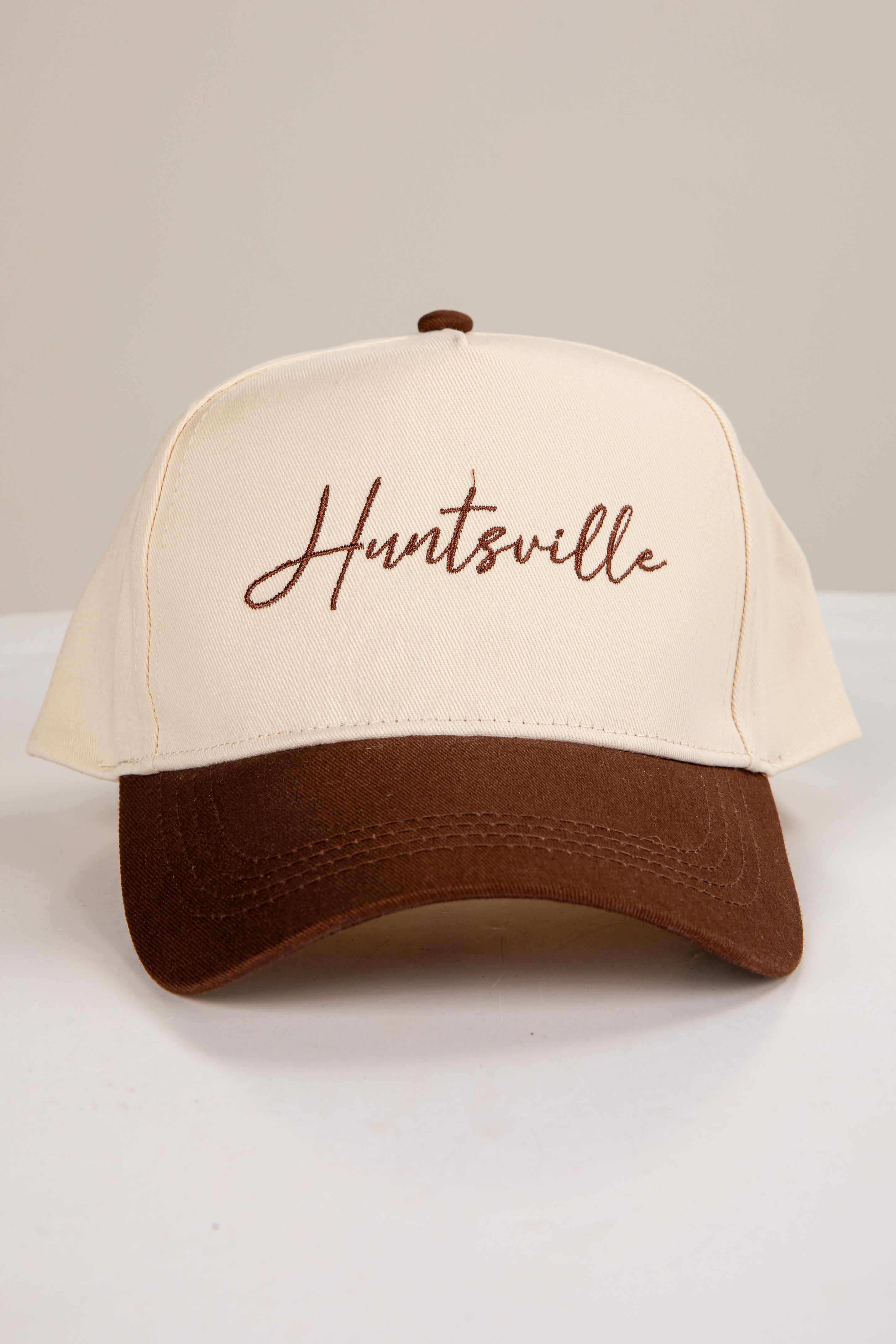 Beige and brown cap with &