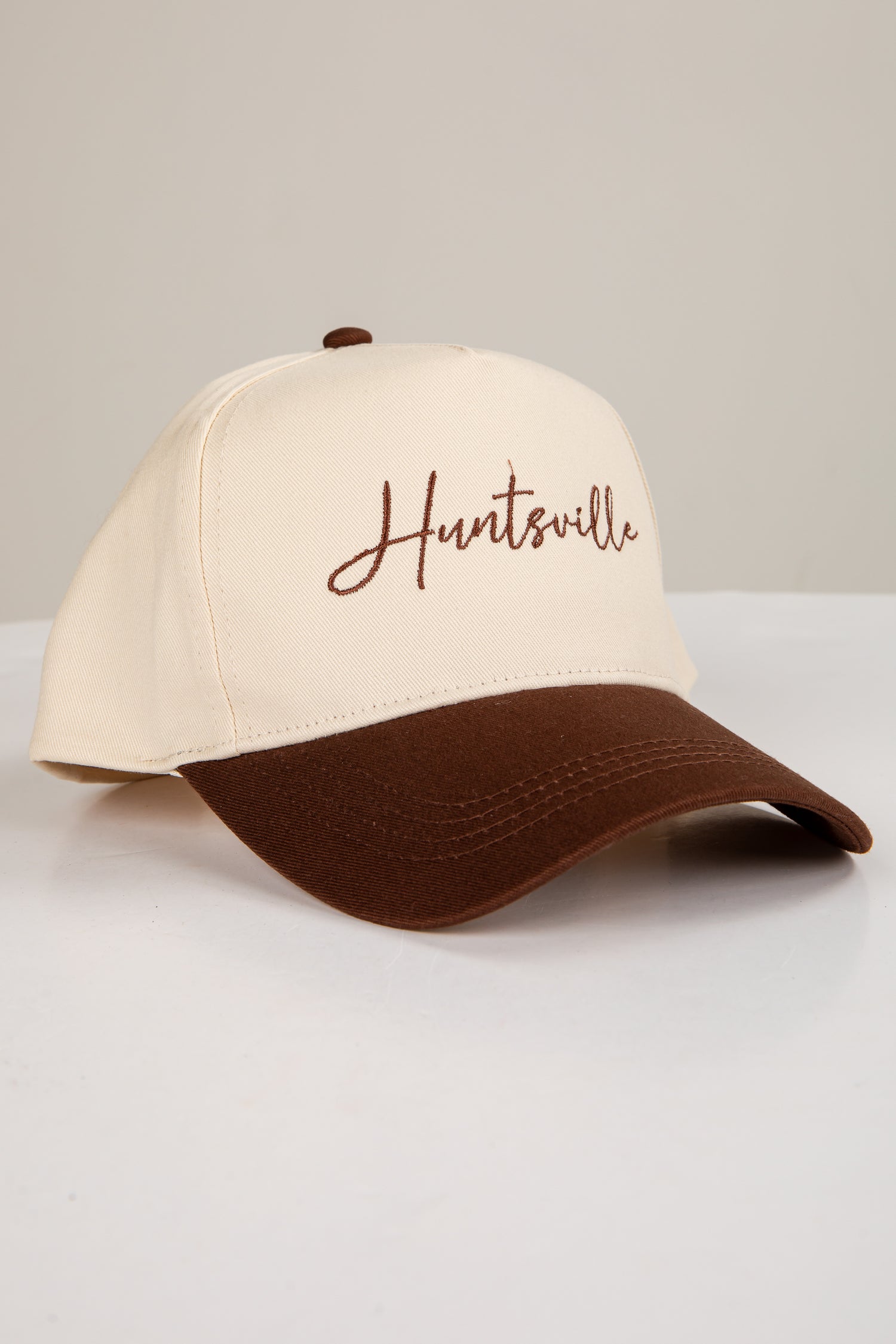 Beige and brown cap with &