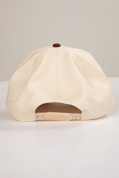 Beige baseball cap on a light gray background