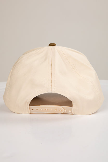 Beige baseball cap on a light gray background