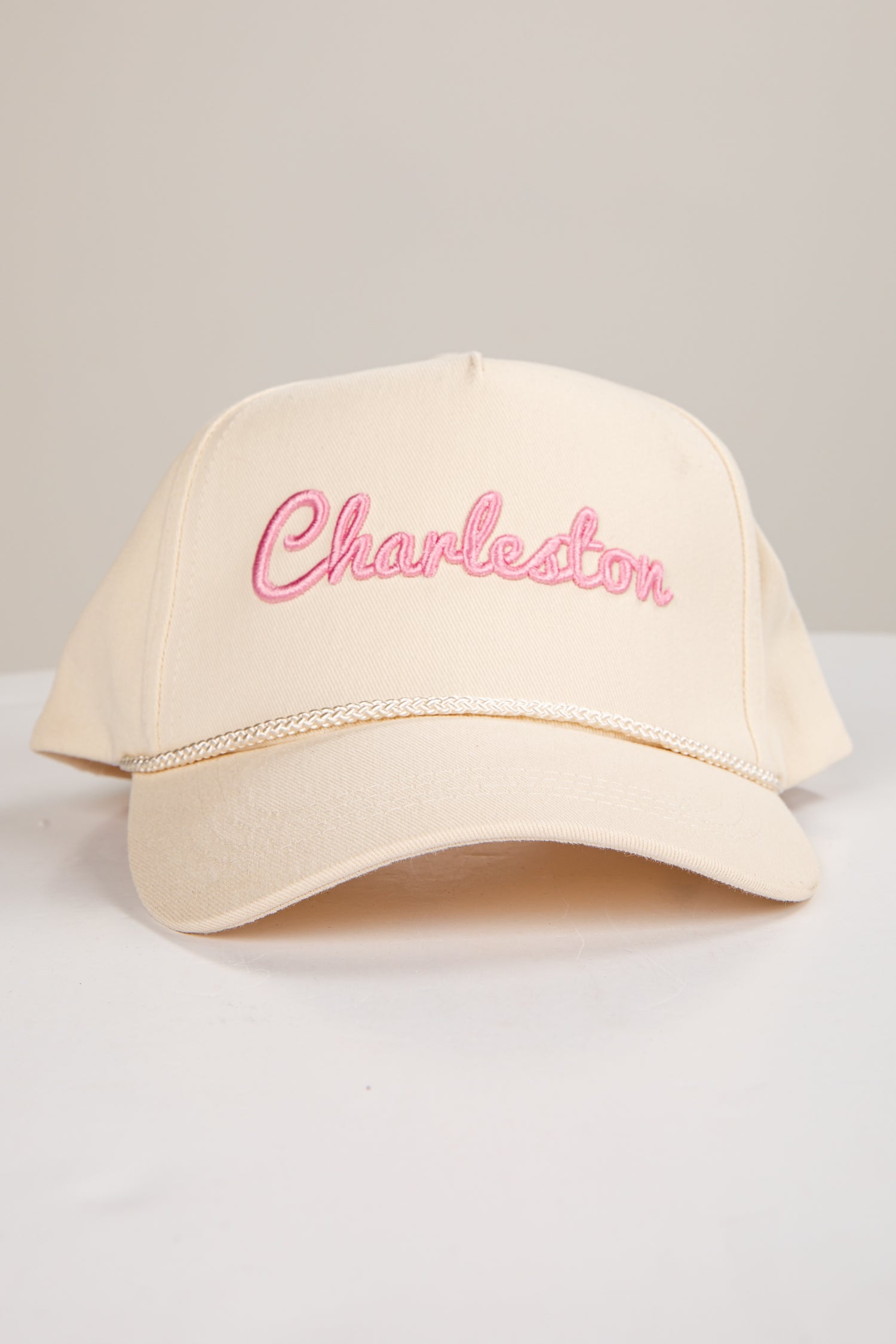 Beige cap with &