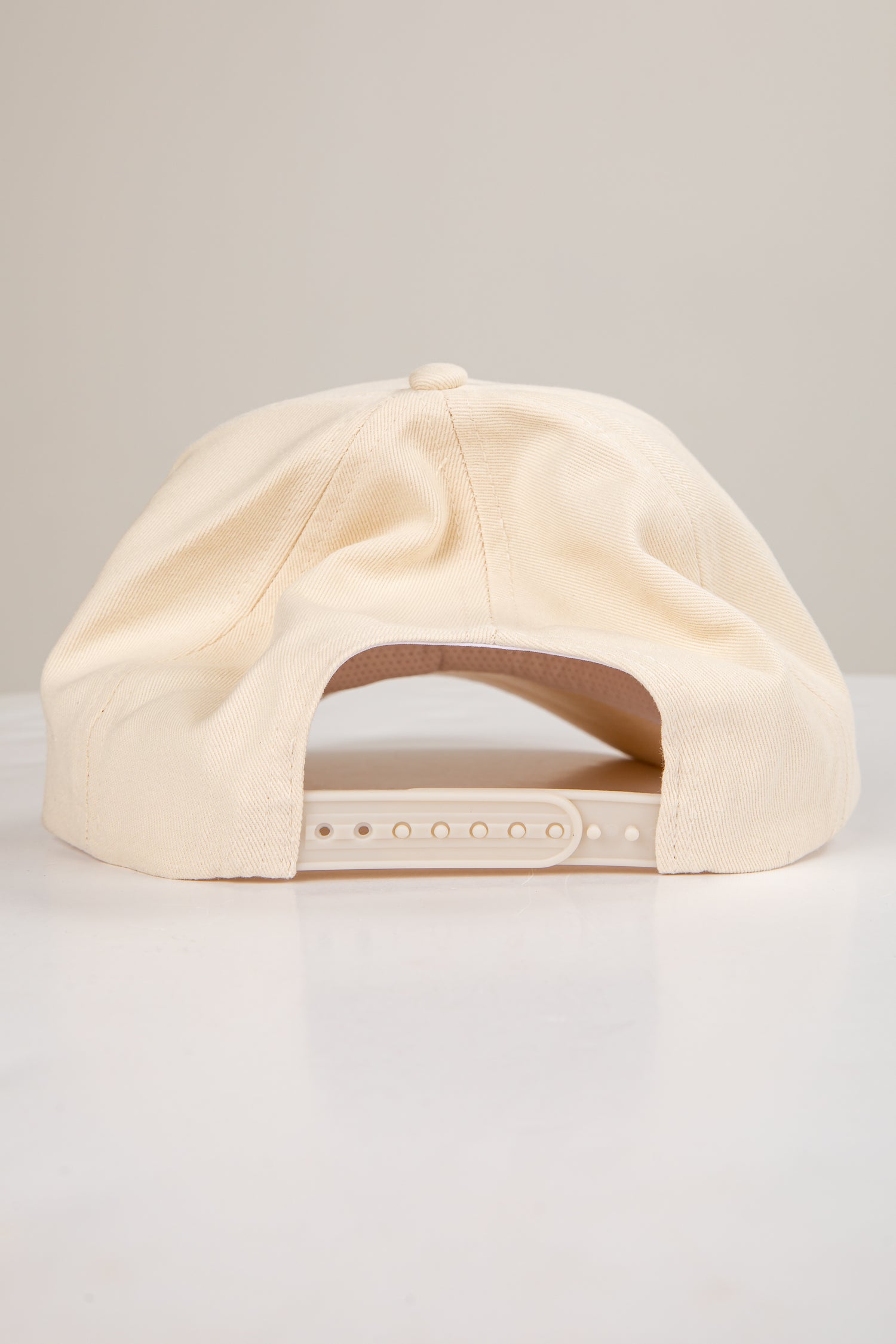 Beige cap on a light gray background