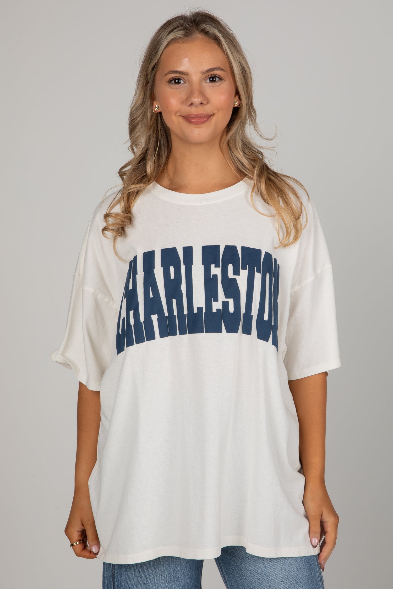 Woman wearing a white t-shirt with &