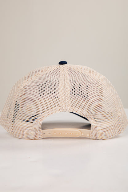 Beige mesh cap with a small logo on a light gray background