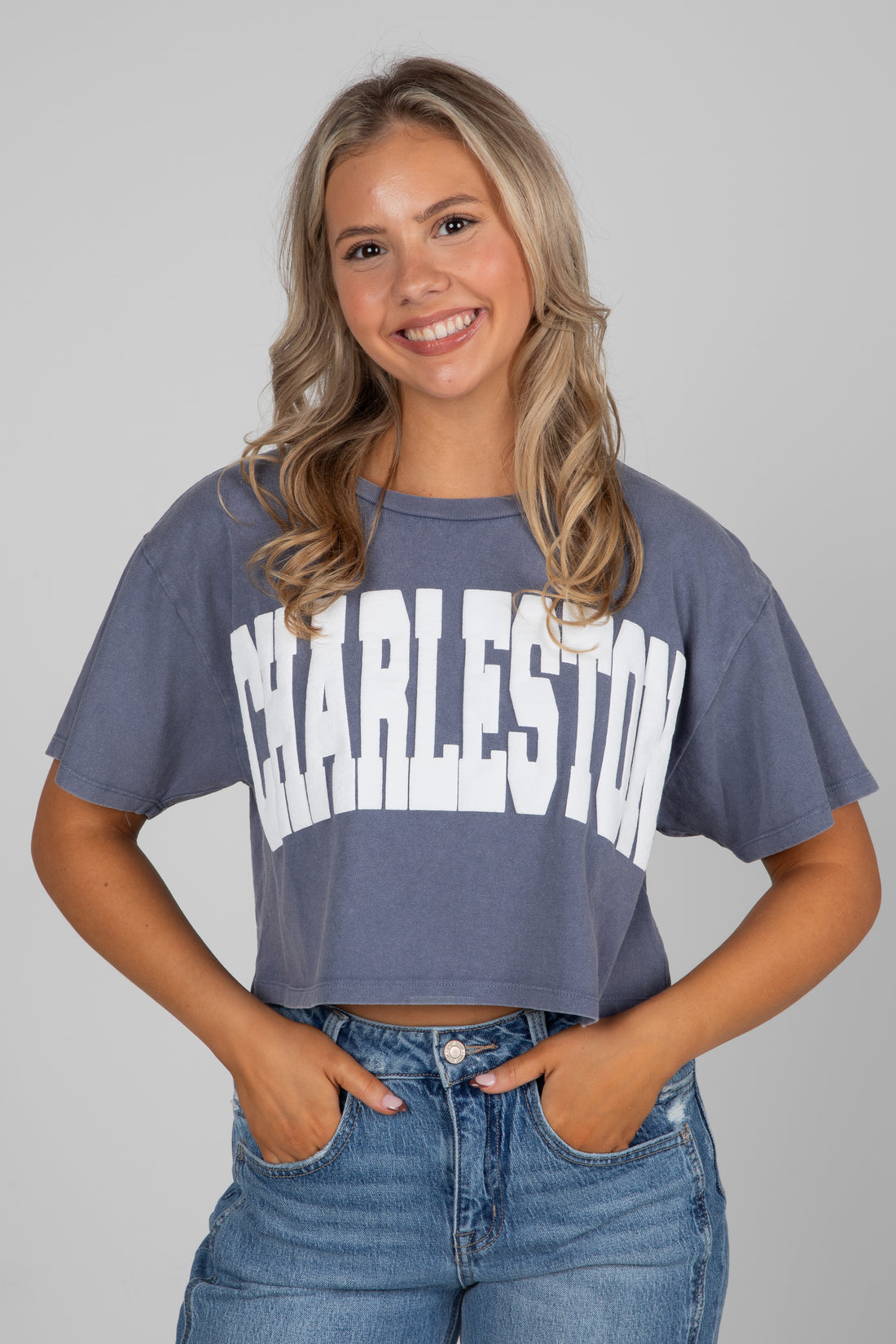 Woman wearing a gray t-shirt with &