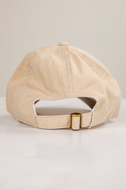 Beige baseball cap on a light gray background