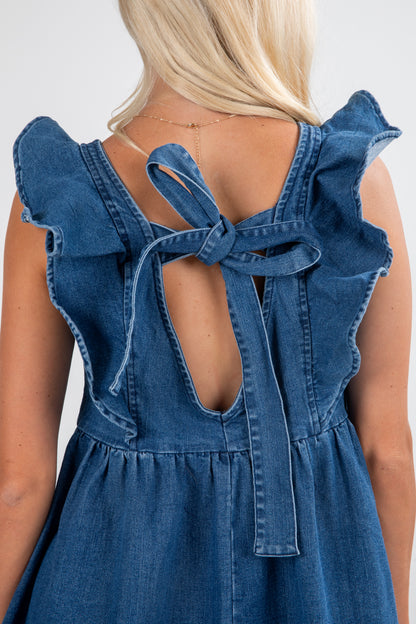 Blue denim dress with ruffled straps and open back on a plain background