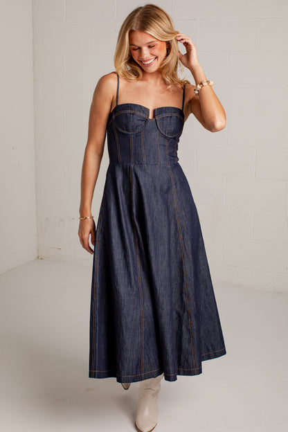 dark-wash dress features a strapless bustier-inspired bodice with defined seaming and a flattering fitted silhouette