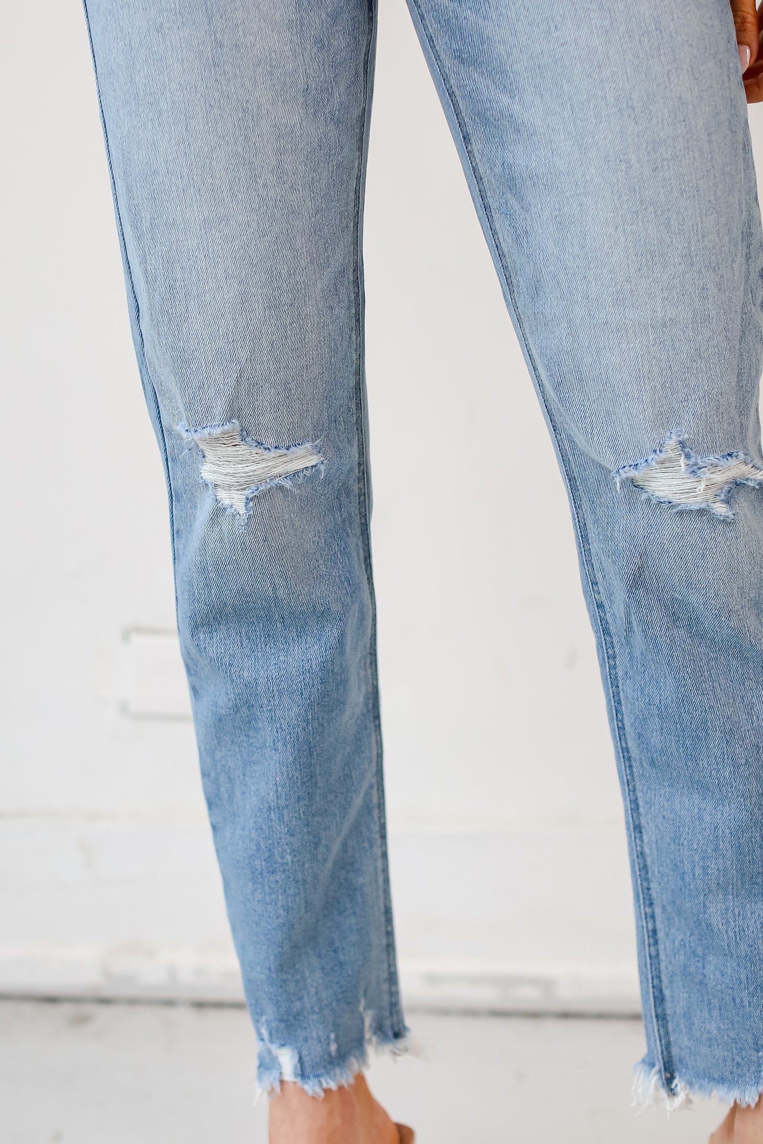 medium wash Distressed Mom Jeans close up