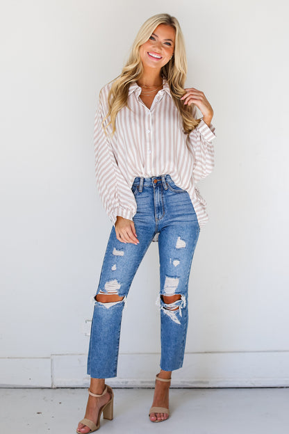 medium wash Distressed Mom Jeans on dress up model
