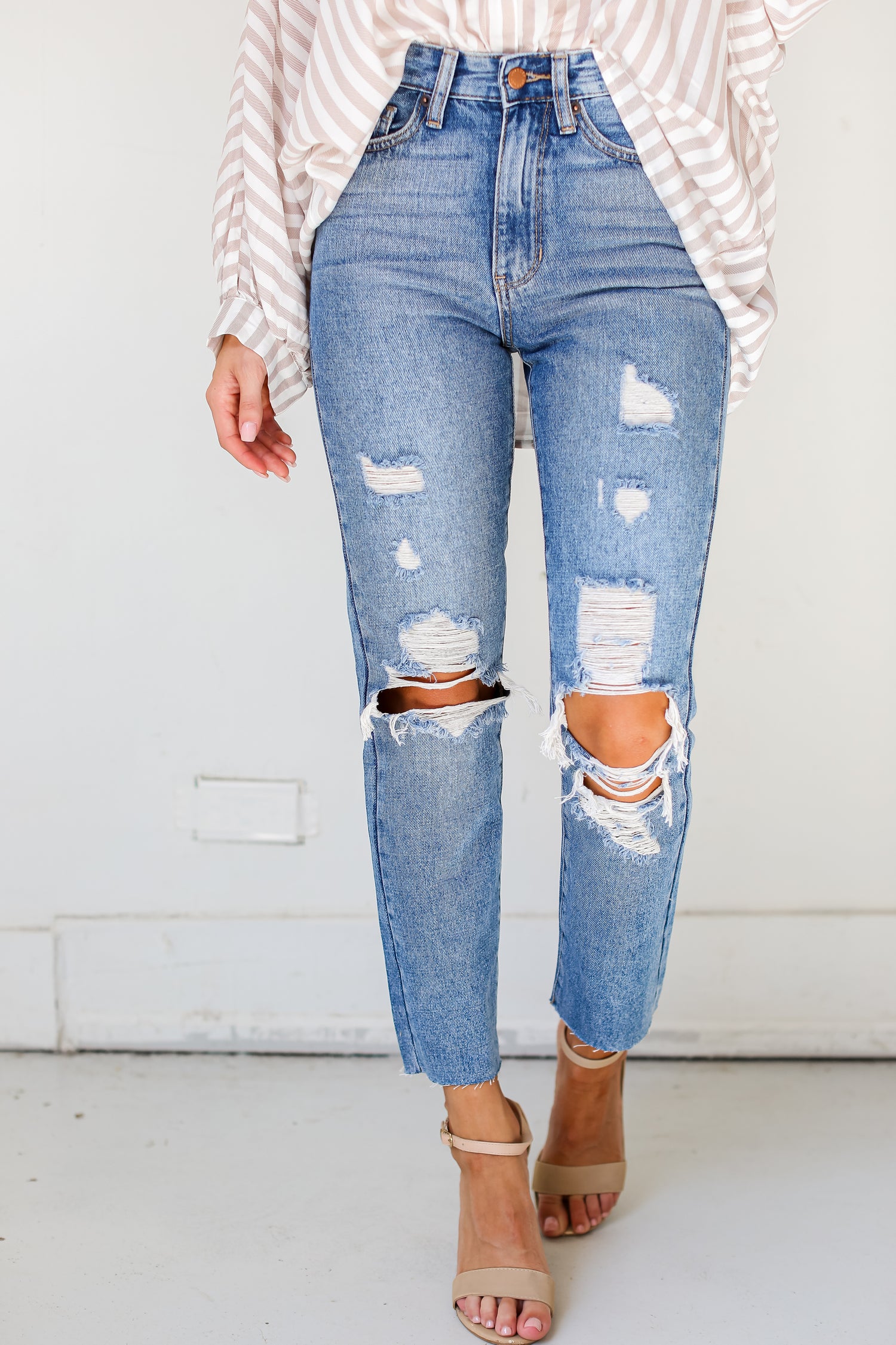 medium wash Distressed Mom Jeans close up view