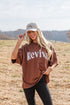 Woman wearing a brown &