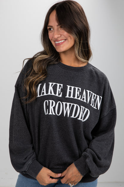 Woman wearing a black sweatshirt with &