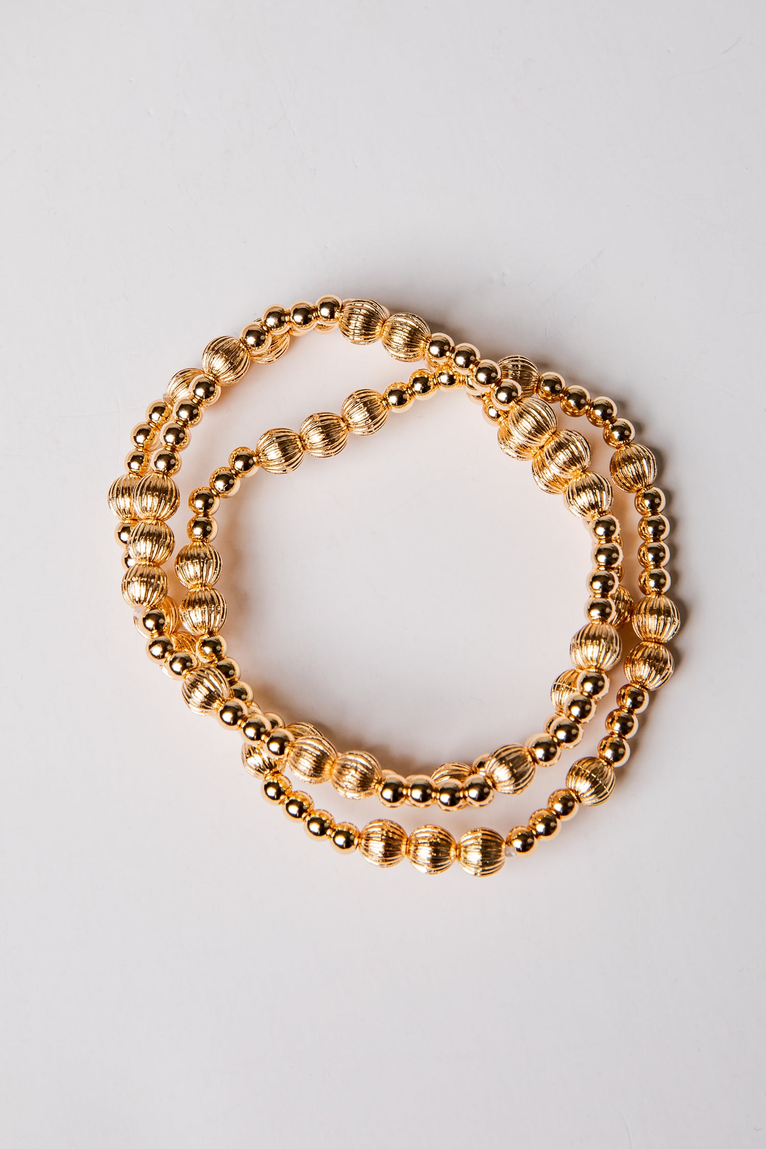 set of 3 gold beaded bracelets