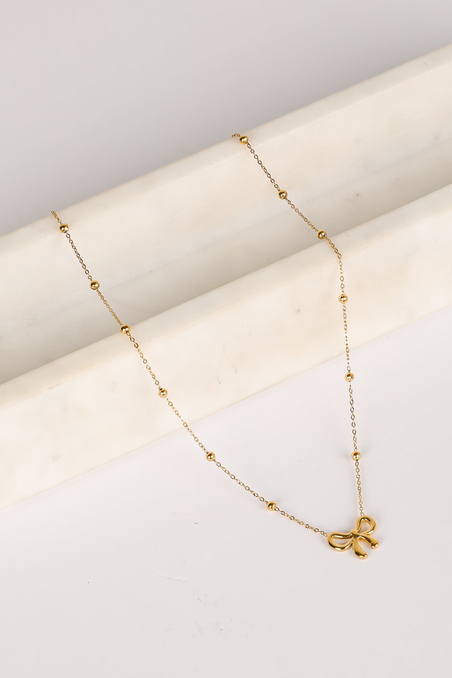 Elizabeth Gold Bow Charm Necklace