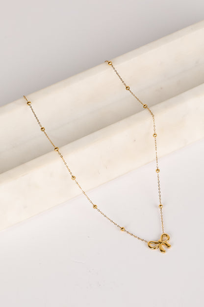 Elizabeth Gold Bow Charm Necklace