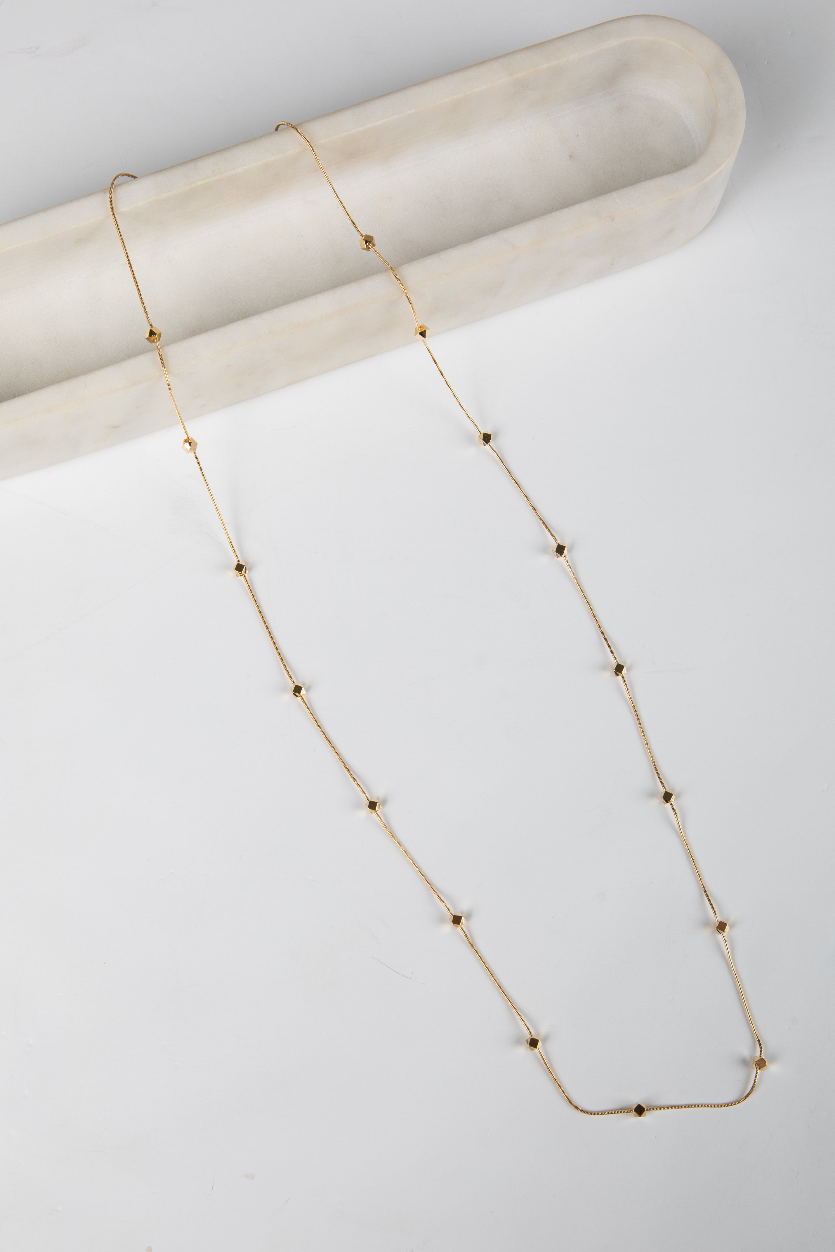 Gold necklace on a white background