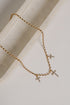 Naomi Gold Cross Charm Necklace