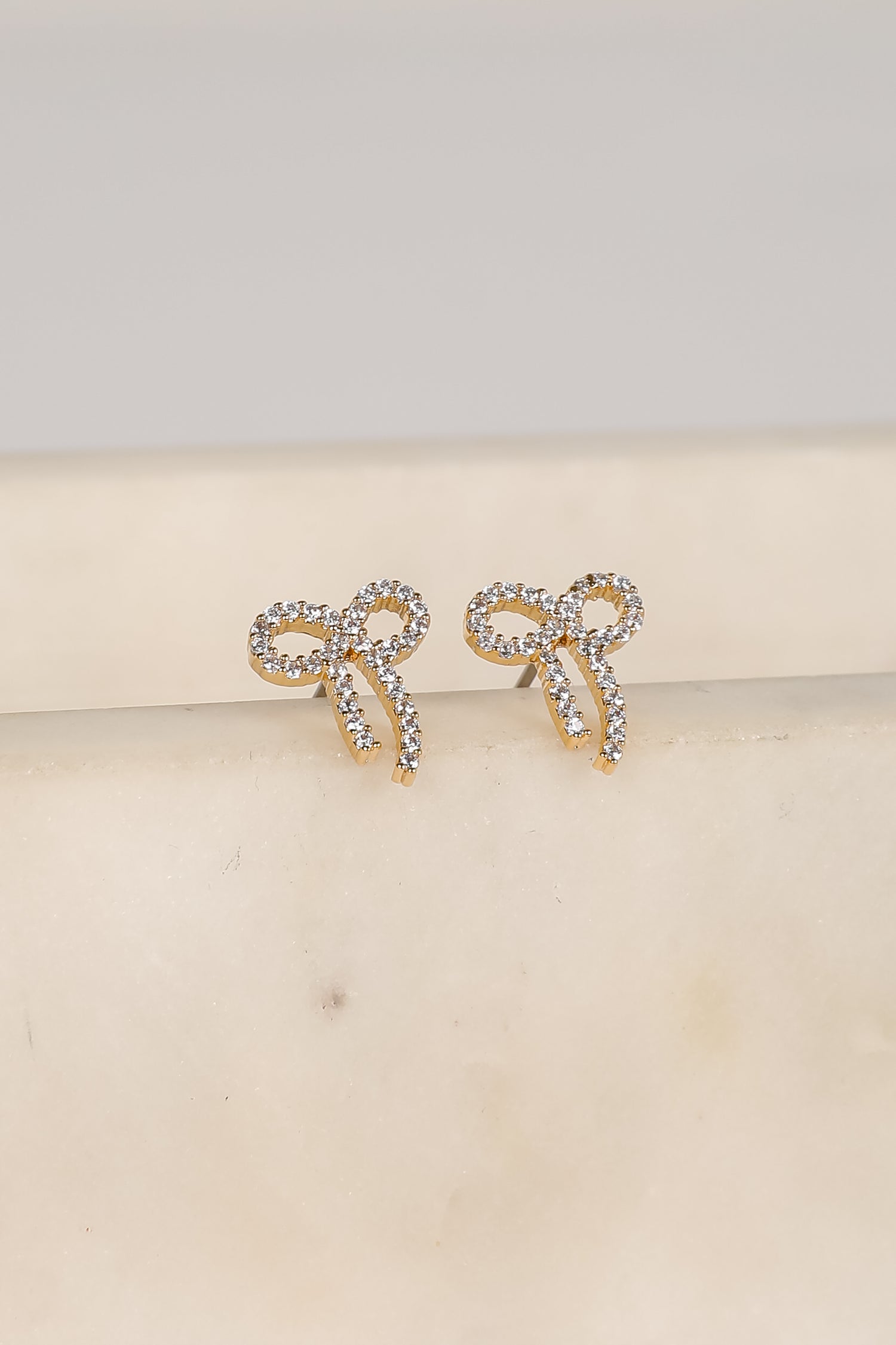 Daniella Gold Rhinestone Bow Earrings