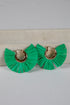 Green ruffled earrings with gold hoop centers on a light gray background