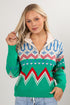Woman wearing a colorful patterned sweater with a plain background