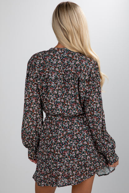 Floral dress worn by a person on a plain background