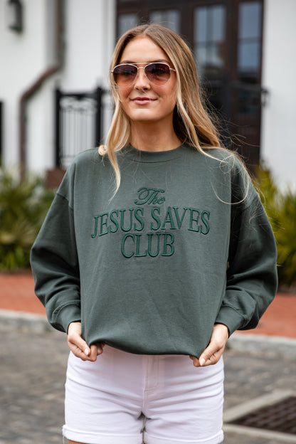 Person wearing a green sweatshirt with &