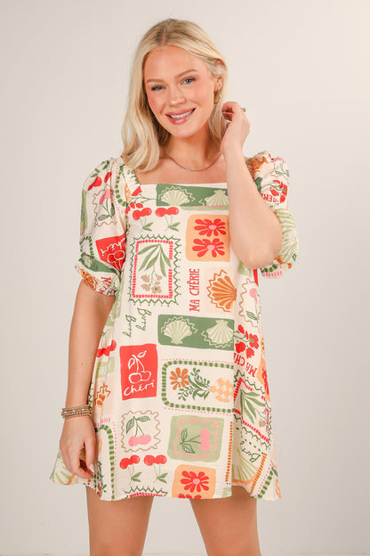 Woman wearing a patterned dress with a neutral background