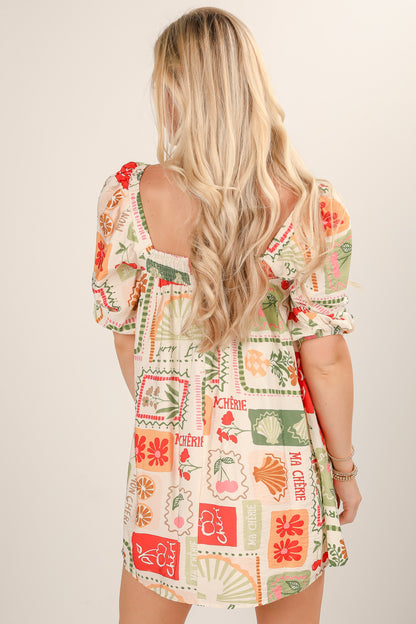 Woman wearing a colorful patterned dress with floral and geometric designs.