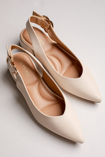 A pair of pointed-toe slingback flats in a light cream color with a tan insole and a small gold buckle on the ankle strap, shown on a light gray background.