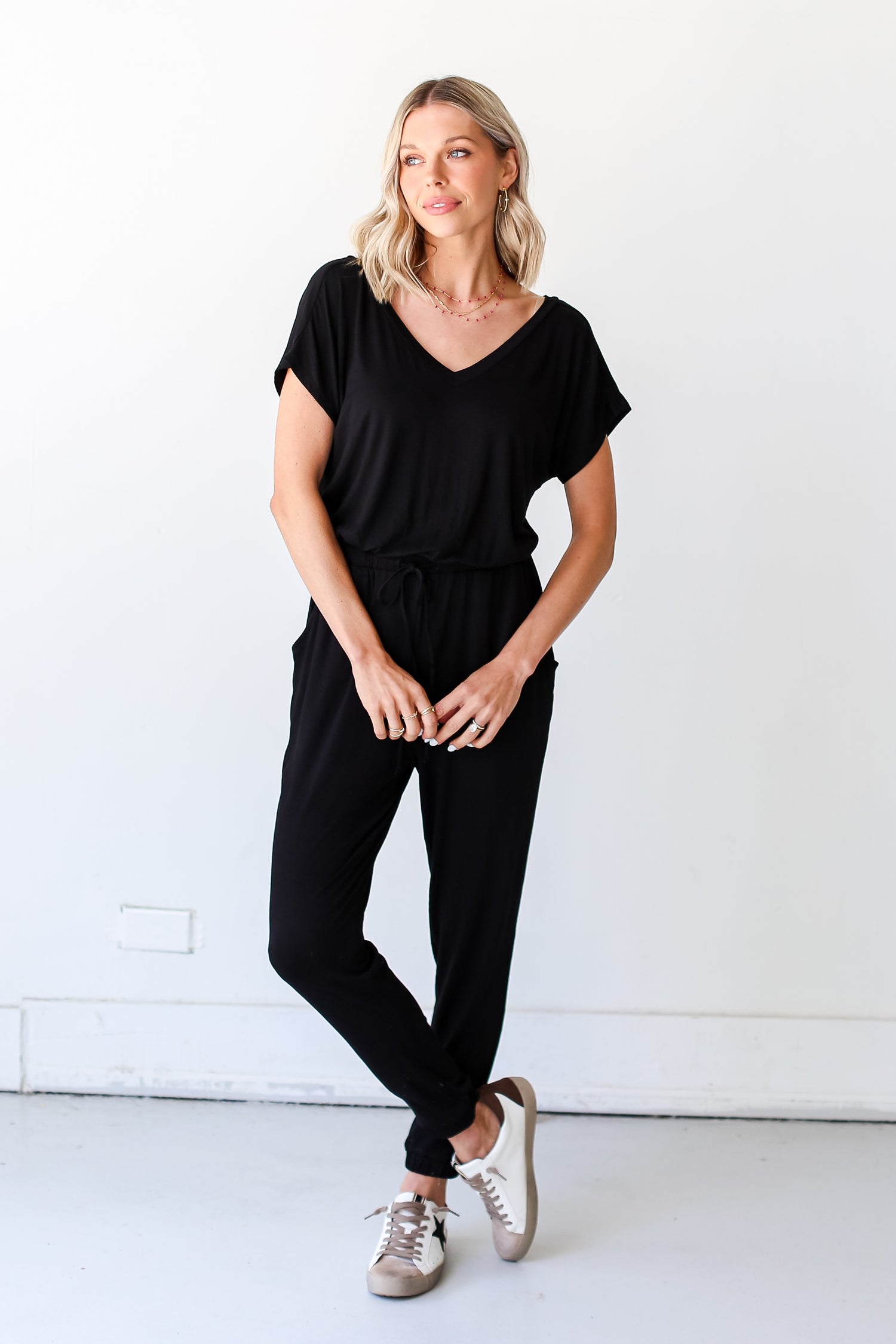 black Jumpsuit with sneakers