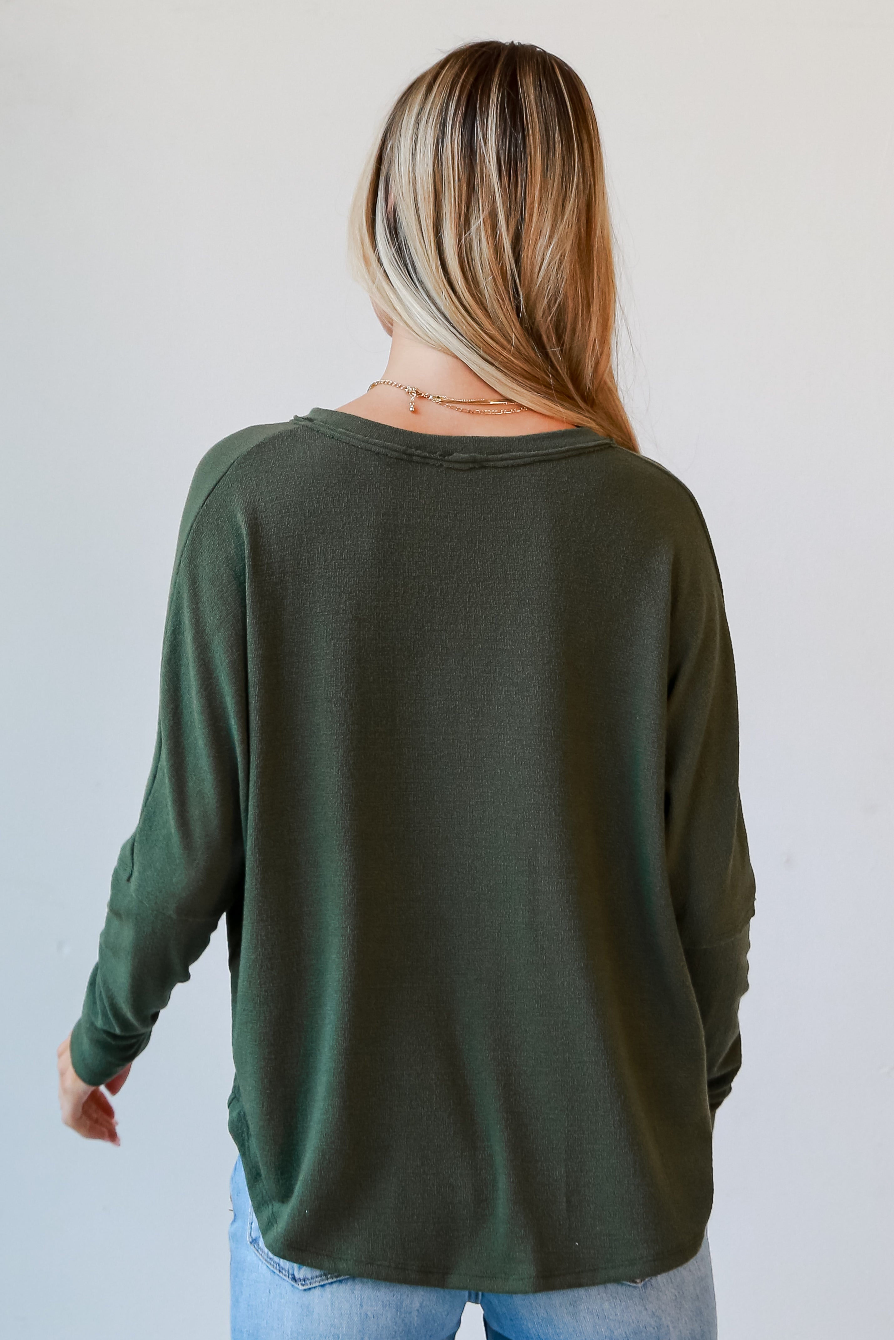 green knit top