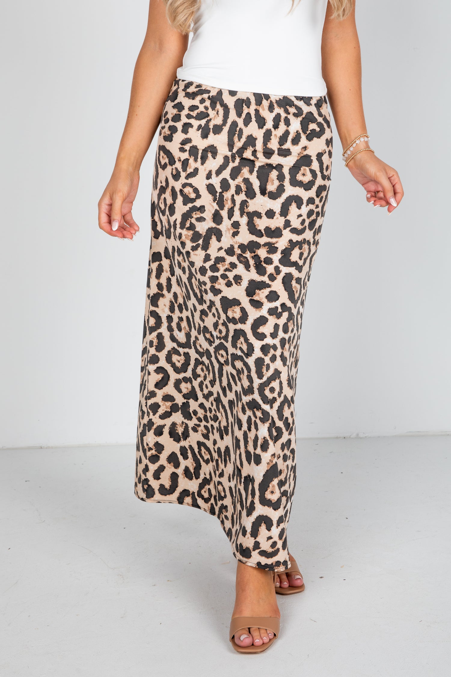 Leopard print skirt worn by a person on a white background