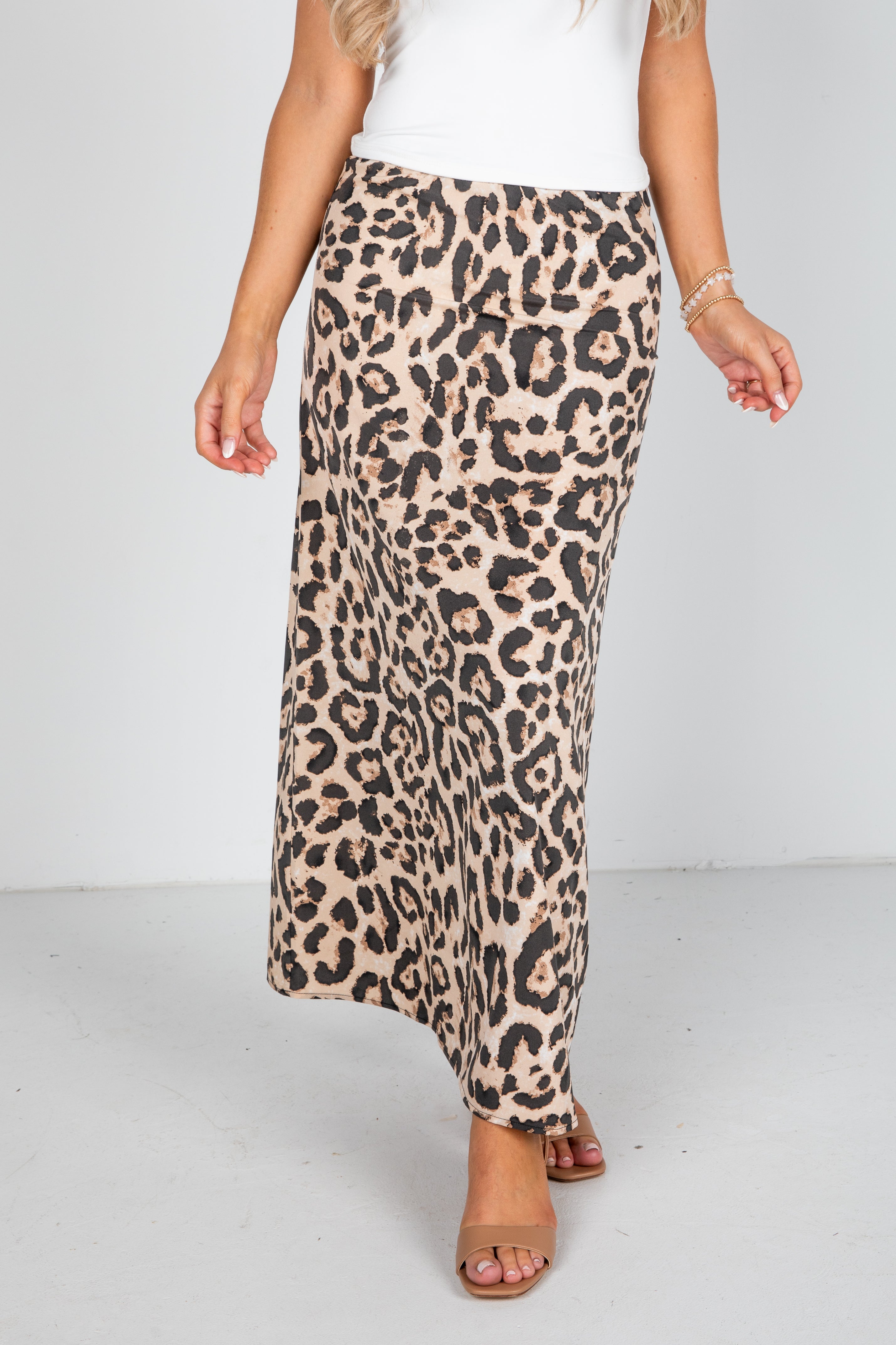 Leopard print skirt worn by a person on a white background
