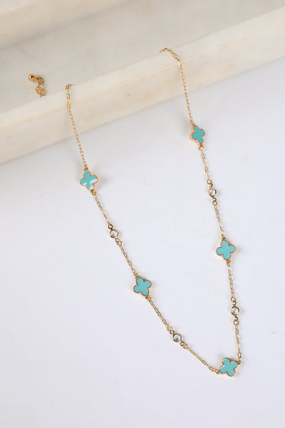 Necklace with turquoise flower-shaped pendants on a white background