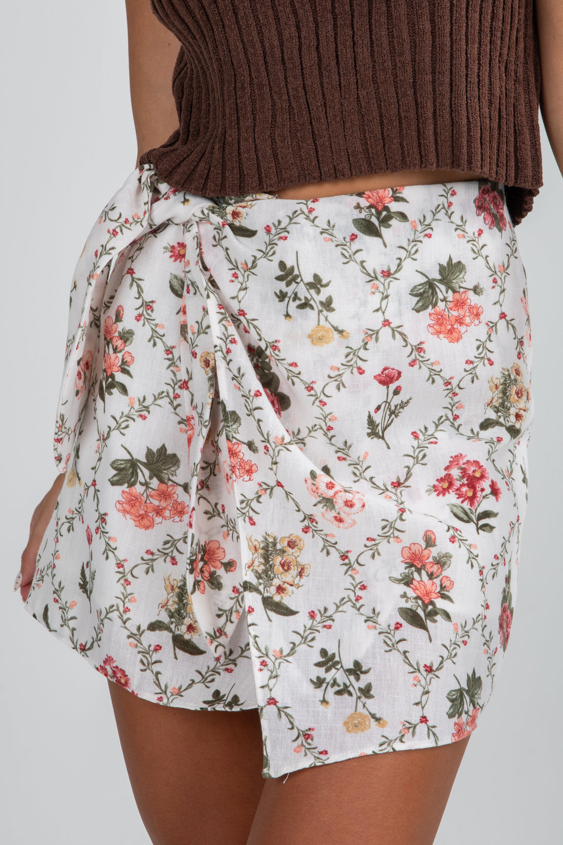 Floral wrap skirt on a plain background